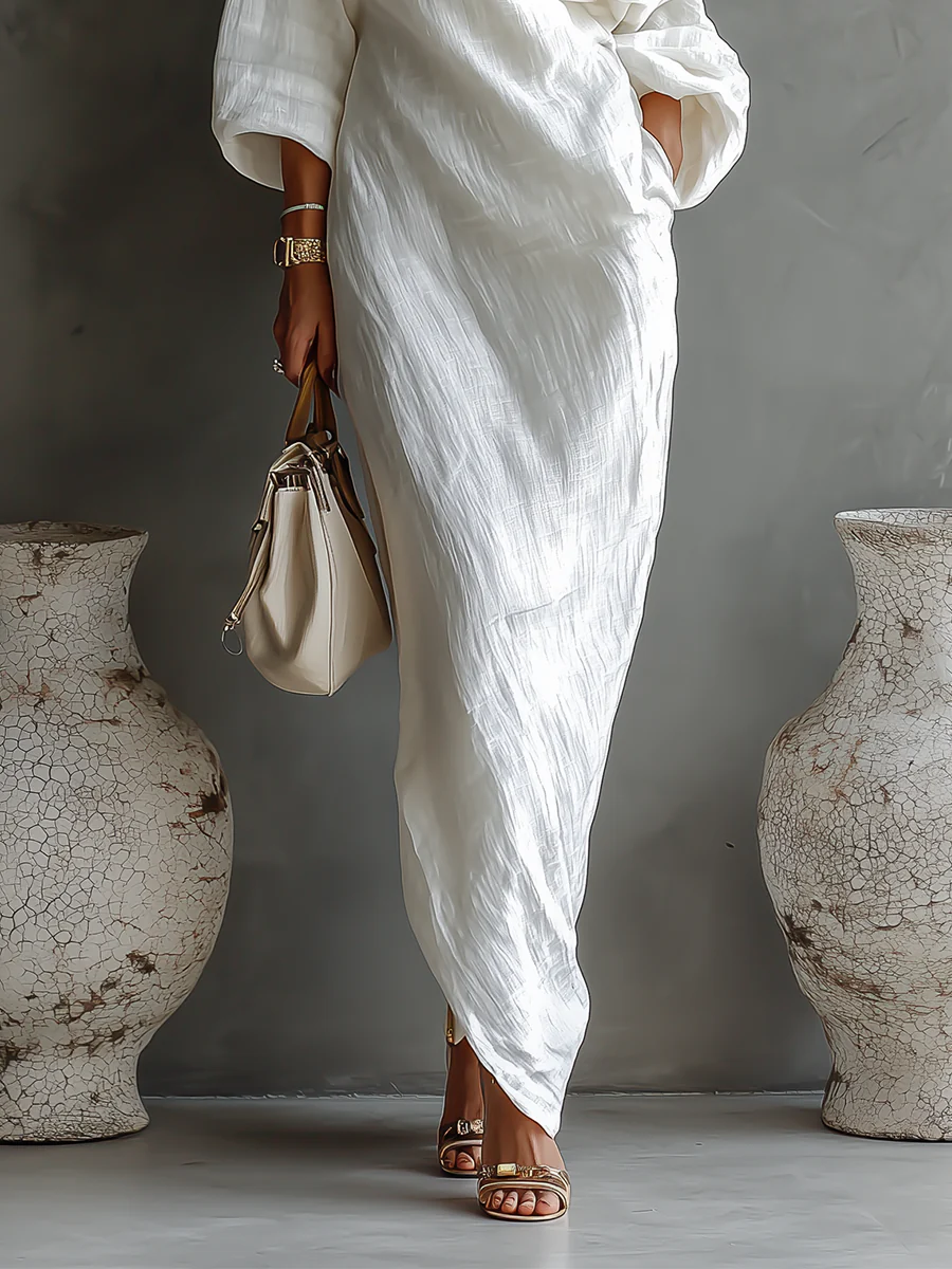 "Nelle™ - Elegancka Sukienka Maxi" can be rewritten as "Nelle™ - Stylowa Maxi Sukienka".